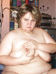 Big boobed plump playing and posing in the kitchen